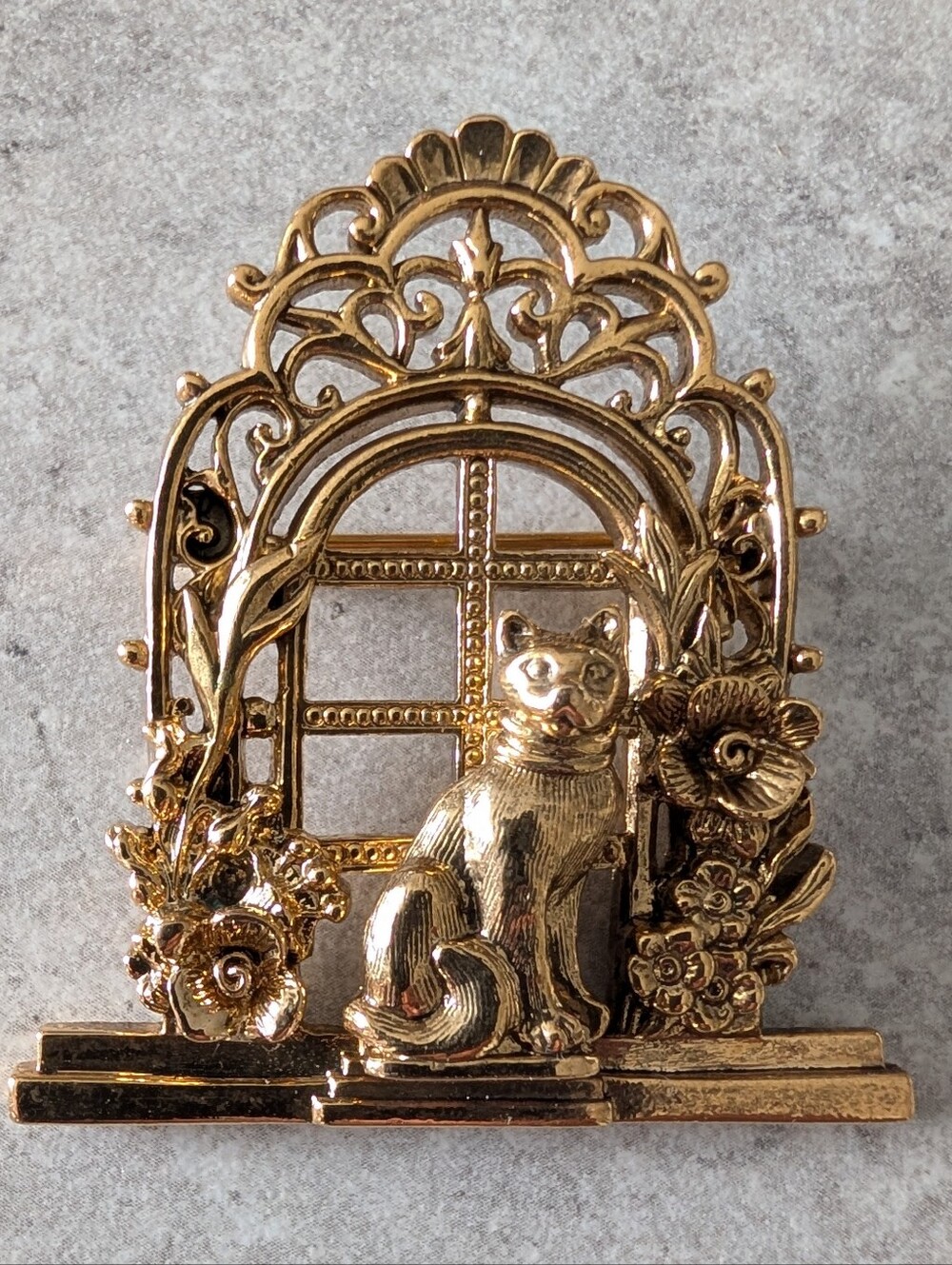 1928 Gold Tone Cat By An Ornate Window Brooch